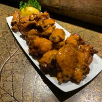 Buffalo Wings (K-54) · 8 ~ 10 PCS Deep fried wings with homemade special hot sauce.