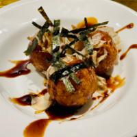 Takoyaki (K-76) · Octopus balls is a ball-shaped Japanese snack made of a wheat flour-based batter and cooked ...