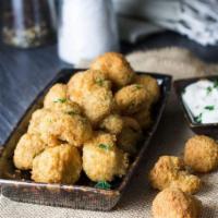 Breaded Mushrooms · 12 pieces. Served with ranch.