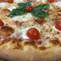 Margherita Pizza · Fresh mozzarella, Parmesan, San Marzo tomato sauce, basil and olive oil.