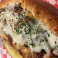 Steak Bomb  · Sliced sirloin beef, salami, banana peppers, mushrooms, green peppers, onions, smothered in ...