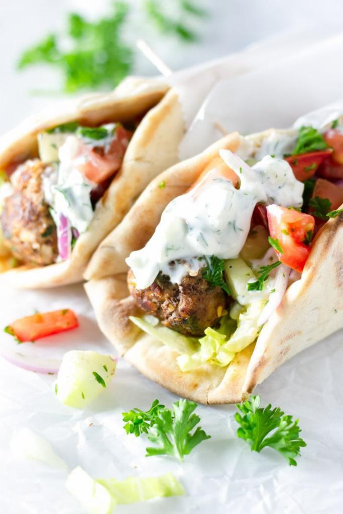 Gyro  ·  Sliced beef and lamb with tzatziki sauce, lettuce, tomato and onions on a pita bread. Tzatziki sauce on the side.