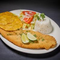 Breaded Fish Filet · Breaded fish filet with rice and salad.