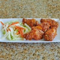 Canh Ga · Vietnamese style chicken wings caramelized in a garlic pepper marinade.