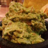 Guacamole al Molcajete · Fresh guacamole made with avocado, tomatoes, onions, cilantro and fresh jalapeno. Served wit...