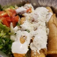 3 Flautas rice/beans · Crispy rolled corn tortillas stuffed with chicken, steak or cheese topped with lettuce, chop...
