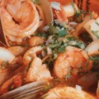 Sopa de Mariscos · Large Seafood soup with shrimp, clam, calamari and fish. With side of tortilla