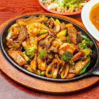 Fajita Mixta · Mixed fajita with 3 meats; chicken, steak and shrimp. Sauteed bell peppers, zucchini, tomato...