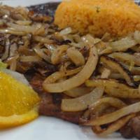 Bistec Encebollado · Grilled butterfly onion steak served with lettuce and pico de gallo. Served with rice, beans...