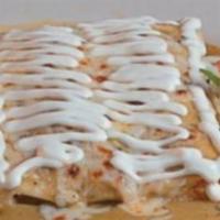 Trio de Enchiladas · 3 rolled corn tortillas. 1 with shrimp, 1 with chicken and 1 with steak. Topped with green s...