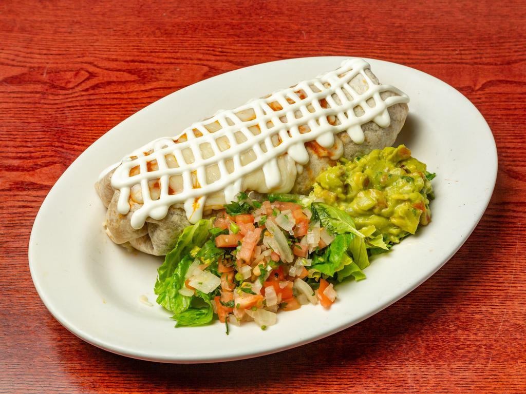 Tinga Burrito · Shredded chicken in chipotle sauce; Large flour or whole wheat tortilla stuffed with rice, beans, cheese, pico de gallo, sour cream and guacamole on the side.