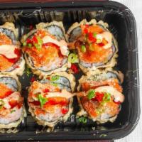 Volcano Roll · Tempura fried crab avocado roll, topped with spicy tuna, spicy mayo, eel sauce, and tobiko.