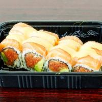 Sunrise Roll · Spicy tuna and avocado inside, topped with salmon, spicy mayo and miso sauce.