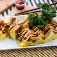 Lion King Roll(10pcs) · Shrimp tempura, spicy tuna, avocado wrapped in soy paper, topped with spicy mayo and eel sau...