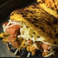 1 Shredded Chicken Arepa · Combine our shredded chicken with the ingredients of your choice