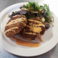 Jackfruit Crab-less Cake · Two large crab-less cakes, red chile remoulade, served over mixed greens. (Vegan)