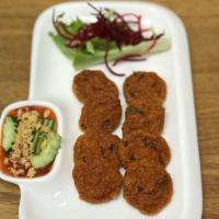 8 Piece Fried Fish Cakes · Fish cakes mixed with Thai spices served with sweet chili sauce cucumber salad and ground pe...
