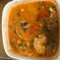 Creamy Tom Yum Soup · spicy broth, lemongrass, bell peppers, onion, milk, mushroom, scallion and cilantro. Medium ...