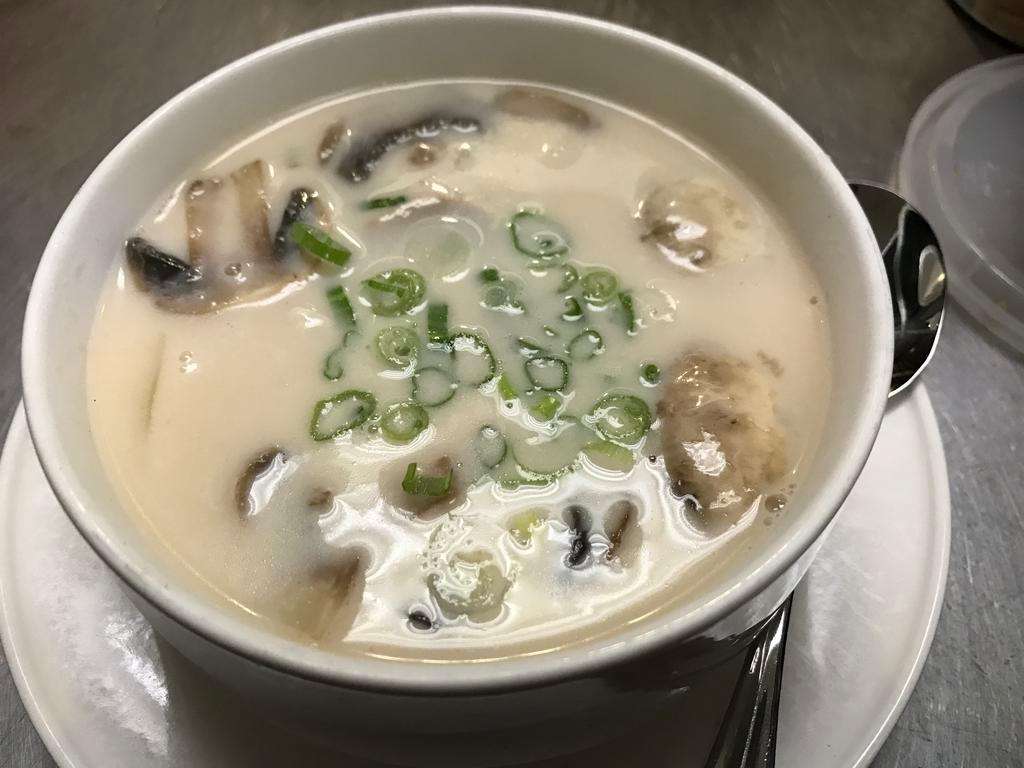 Galanga Coconut Soup · Coconut milk broth, mushroom, Thai herb and cilantro.