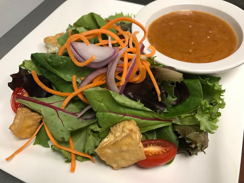 House Salad · Mixed green, fried tofu, onion, tomato with Thai peanut dressing.