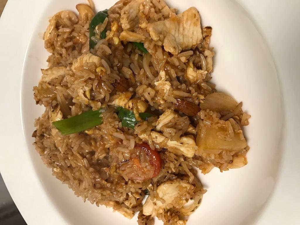 Pineapple Fried Rice · Served with egg, onion, scallion, black pepper,tomato, pineapple and cashew nuts.