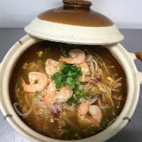 Tom Yum Noodle Soup · Tom yum broth with ground peanut, bean sprout, scallion and cilantro. Medium spicy.