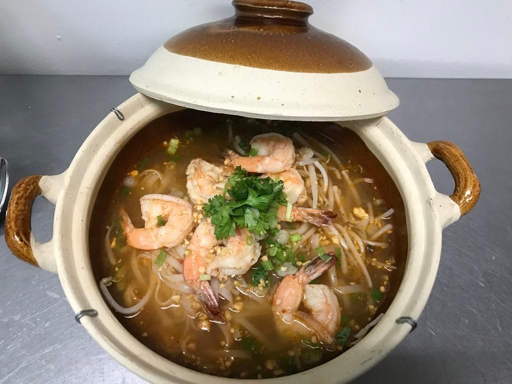 Tom Yum Noodle Soup · Tom yum broth with ground peanut, bean sprout, scallion and cilantro. Medium spicy.