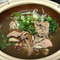 Duck Noodle Soup · Dark soup with bean sprout, Chinese broccoli, scallion and cilantro.