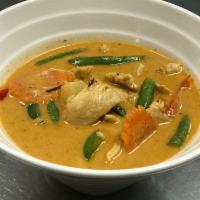 Panang Curry · Served with spicy curry paste, coconut milk, bell pepper, string beans, pineapple and carrot...