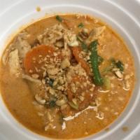 Peanut Curry · Served with spicy curry paste, coconut milk, broccoli, string beans, carrot and ground peanu...