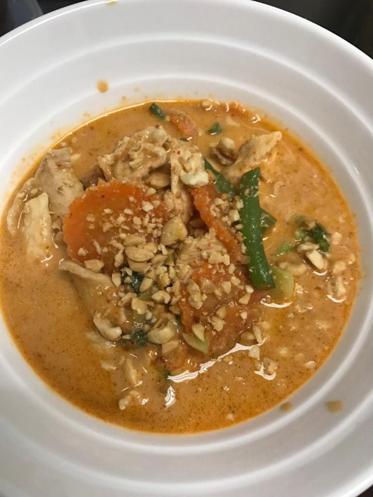 Peanut Curry · Served with spicy curry paste, coconut milk, broccoli, string beans, carrot and ground peanuts. Medium spicy. Served with jasmine rice.