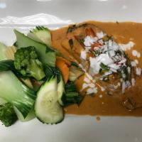 Salmon Chu Chee · Grilled salmon with chu chee curry paste and steamed mixed vegetables