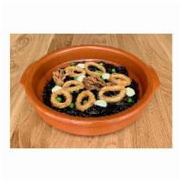 Arroz Negro · Valencia style rice, calamari ink, sofrito, aioli, green peas. with Crispy calamari