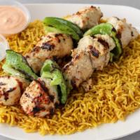 Chicken Kebob Platter · Two skewers of grilled marinated chicken. Served over a bed of rice, pick a side and sauce t...