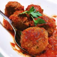 Keftedes · Traditional Greek style meat balls and tomato sauce.