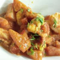 Garides Saganaki · Braised jumbo shrimp in fresh tomato sauce, melted Greek feta cheese and organic herbs.