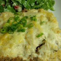 Moussakas · Layers of sauteed ground beef, eggplant, potatoes and topped with bechamel sauce.