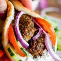 Kebab Sandwich · Mix of ground beef and lamb,served in pita bread with tzatziki,tomatoes and onions
