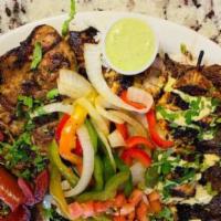 Kachis Parrilla · A carne asada, a deboned chicken, a chicken anticucho, a sausage, a pork chop and two pieces...