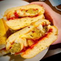 Meatball Parmesan Sub · Baked meatballs, onions and mozzarella and Parmesan cheeses on French bread with homemade ma...