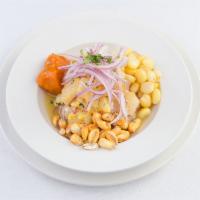 Ceviche de Pescado · Cubed fish marinated with key lime juice and onions, served with lettuce, toasted Peruvian c...