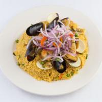 Arroz con Mariscos · A delightful and colorful combination of scallops, shrimp, mussels and rice.