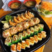Sushi Family Set · 8 pcs rock & roll, 8 pcs bakers field roll, 6 pcs yellow submarine, 6 pcs gyoza, 1 large sal...