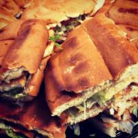Tortas Large Tray · Includes 12 Mexican Sandwiches cut in half (bean spread, lettuce, tomatoes, onions, avocado,...