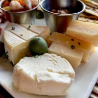 Cheese Plate · Reggianito, honey goat and camembert. Accompanied by pita bread, jam, olives and giardiniera...