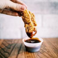 Crispy Chicken Strips · Our Delicious Golden brown Chicken Strips are served with your choice of a dipping sauce