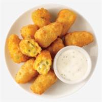 Jalapeno Cheddar Poppers · Our Delicious Jalapeño Cheddar Stuffed Poppers come with a side of house made Buttermilk Ran...