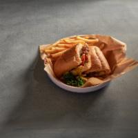 Steak and Cheese Sub · Rib-eye thin-sliced, grilled with onions, topped with provolone cheese, lettuce, tomato and ...