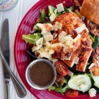 Roasted Chicken Salad · Mixed greens topped with sliced roasted chicken breast, white cheddar, bacon, cucumber and t...