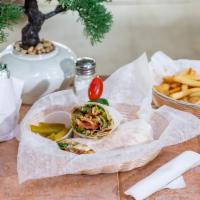 Chicken Shawarma Wrap · Starts with our marinated chicken breast served with homemade garlic sauce, pickles, lettuce...